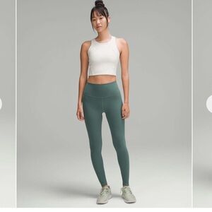 Lululemon wunder train high rise tight 28”
Sz 4 Medium forest